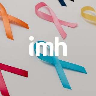 Colourful awareness ribbons (orange, pink, yellow, red, and blue) are arranged on a white background. The lowercase letters imh appear in bold white text over the centre of the image.